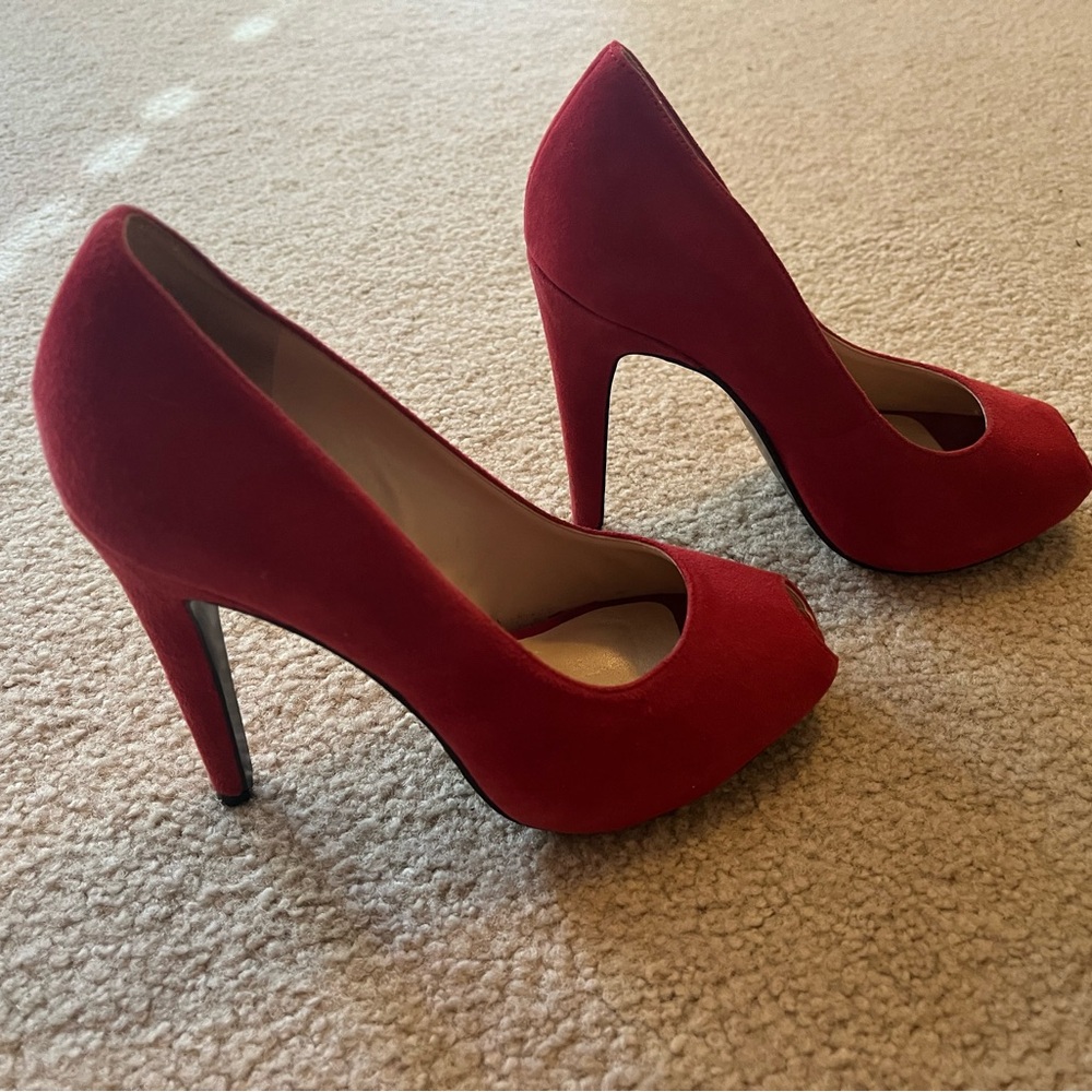 Red suede peep toe pumps. Like new. Super sexy. Great condition.